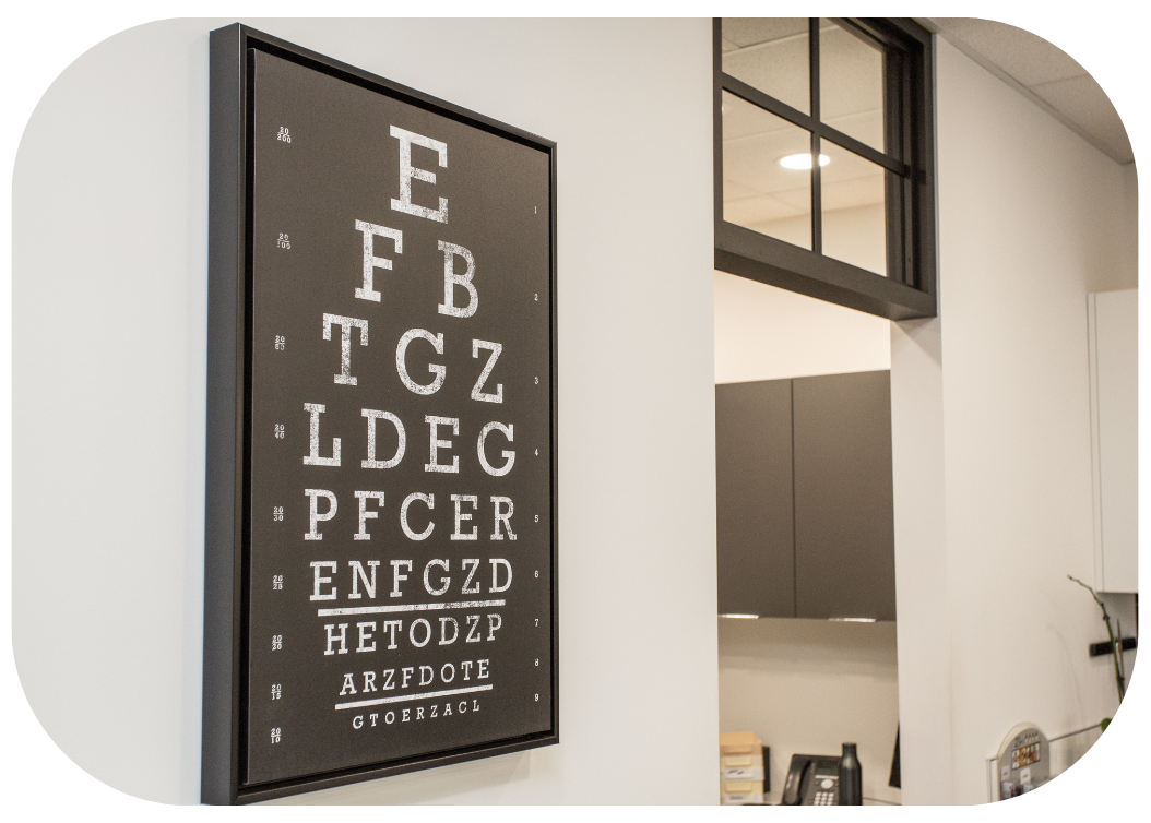 Framed eye chart hanging in The Eye Studio Dispensary Lab